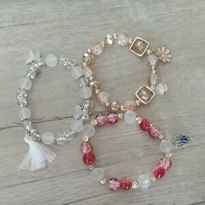 Set of Three Beaded Bracelets with Charms